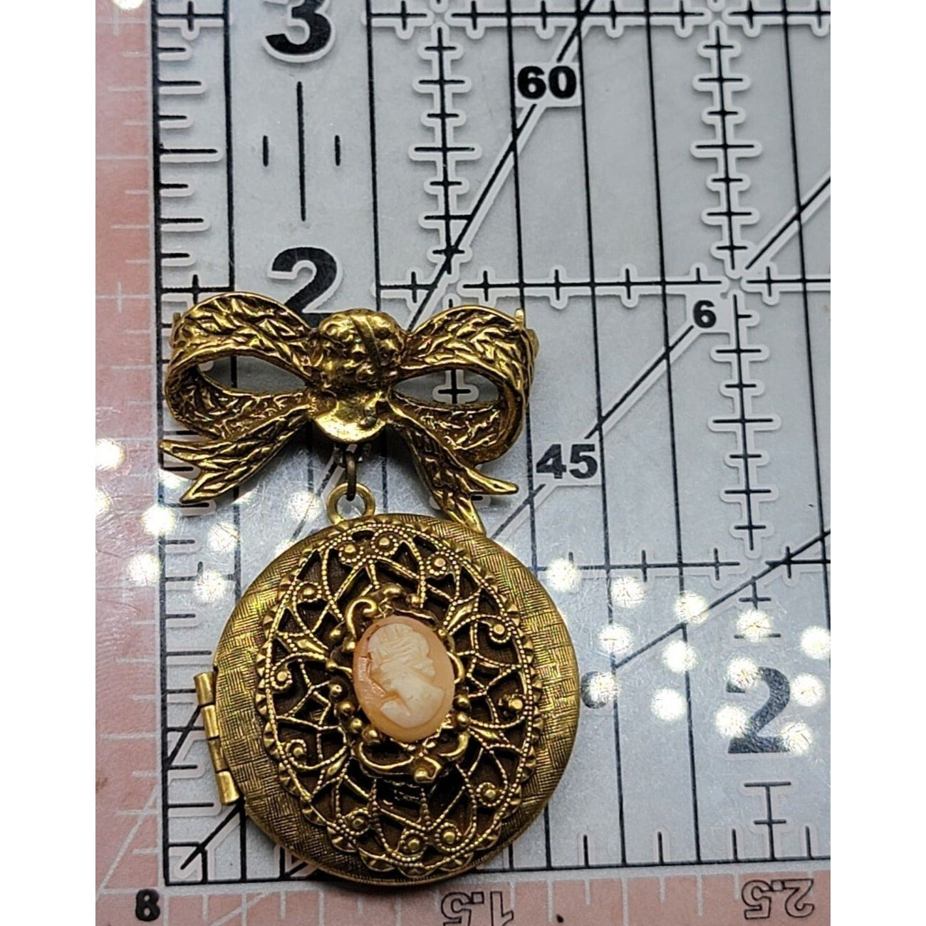 Vintage 1928 Dangling Cameo Locket Brooch Large Bow Gold Tone Resin Pink Lady