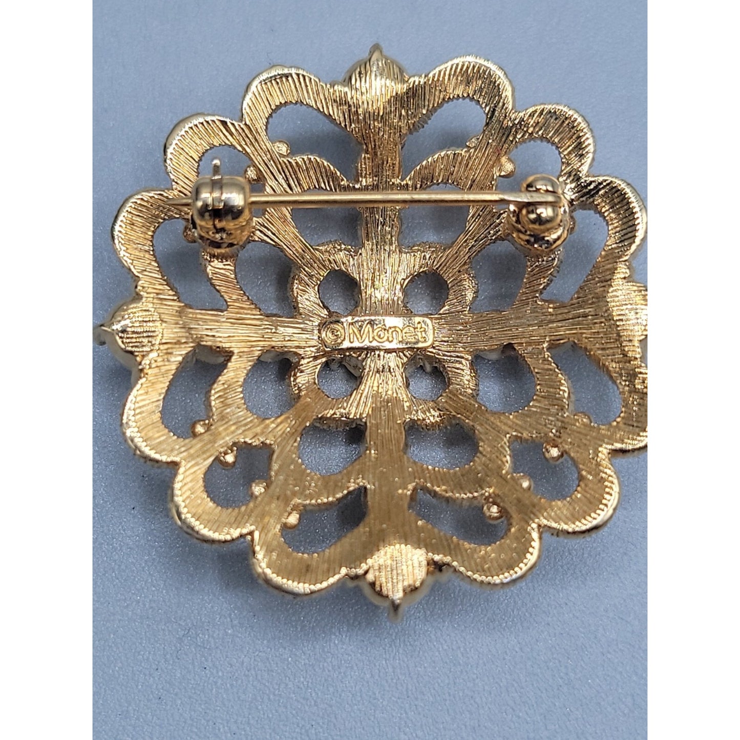 Vintage Monet Rhinestone Cross Brooch Pin Round Dome Textured Gold Tone